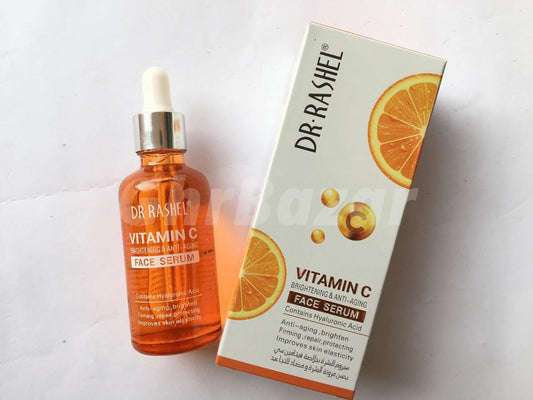 Dr Rashel Vitamin C Face Serum in amber bottle with box, brightening and anti-aging skincare for glowing skin.